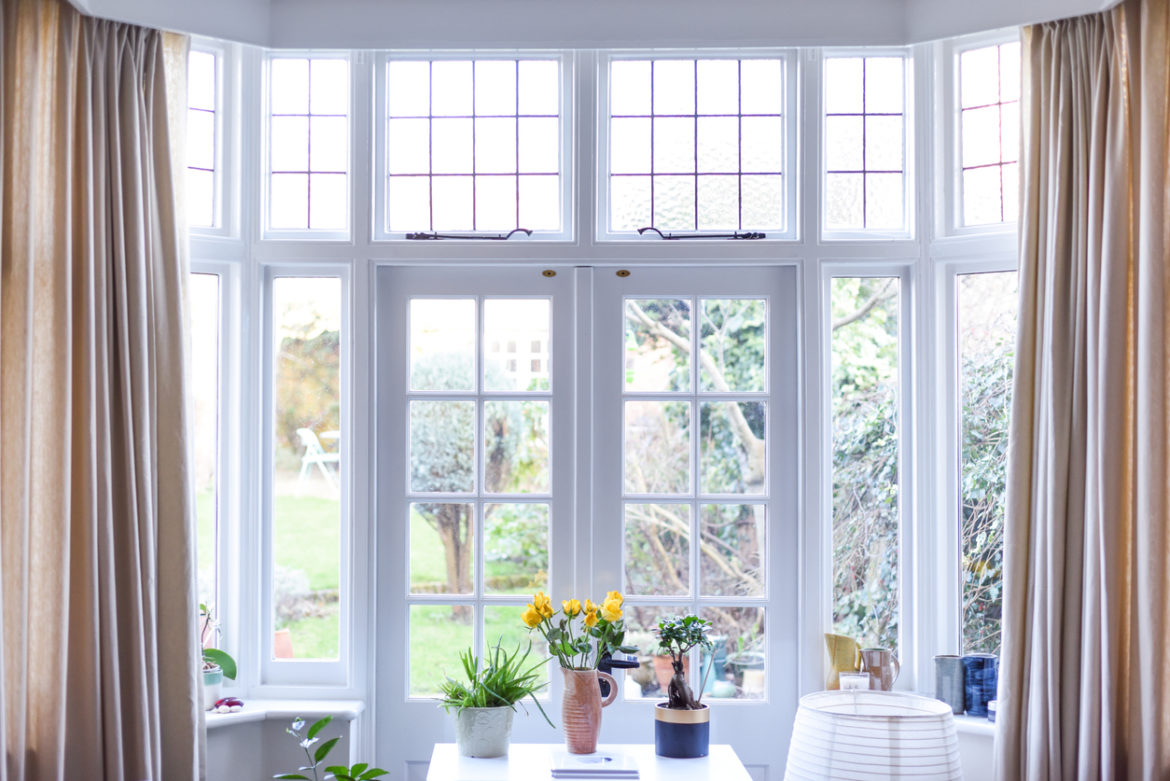 Stylish room interior with french doors and light neutral colours in a modern home